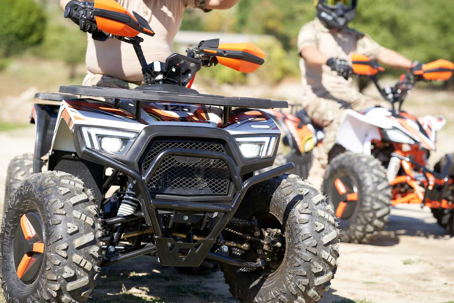 Front end of the 125cc four wheeler: LED headlights, steel grille, front bumper and independent front suspension