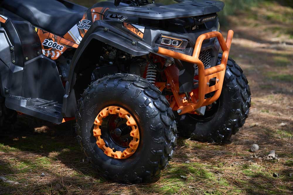 Work ATV FR200ATV-UT hauling on a property, showing its 120kg load capacity utility quad chassis