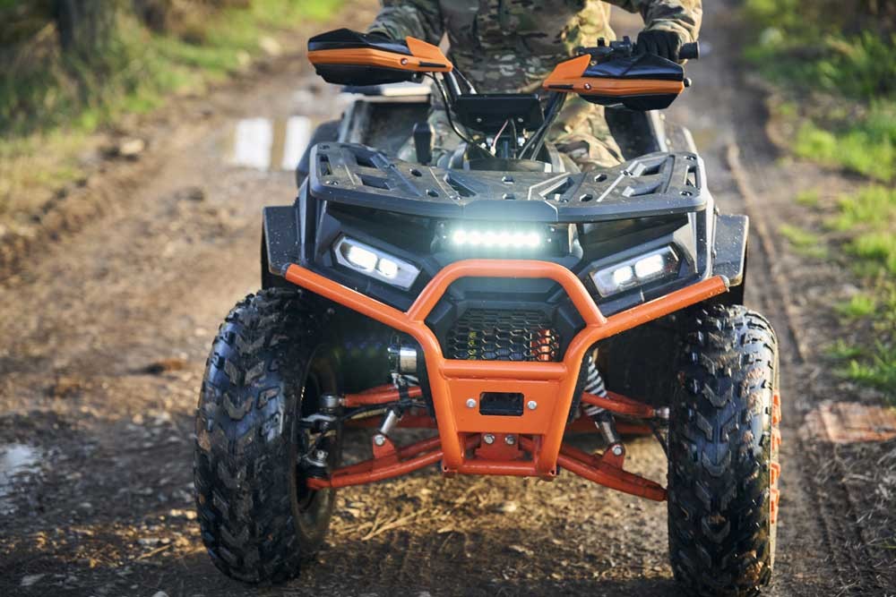 180cc gasoline utility ATV FR200ATV-UT riding a rough unpaved farm trail, a heavy-duty work quad built for real duty